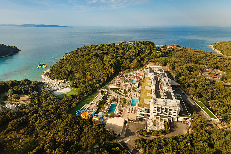 Aerial view of Arba Resort on Rab Island with pools, water park and beachfront