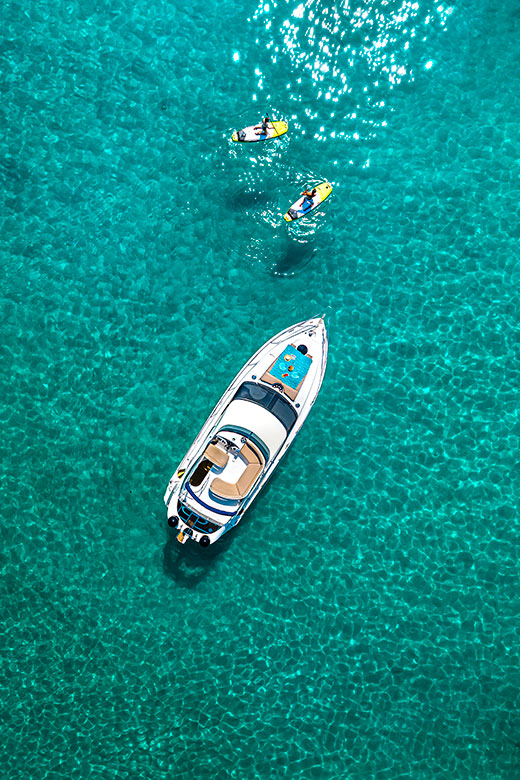 Boat tour and paddleboarding on crystal-clear Adriatic waters in Dalmatia.