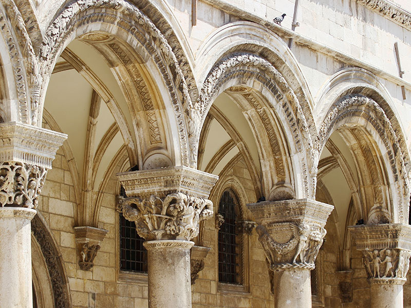 Detail of Romanesque stone arches and columns in Croatia