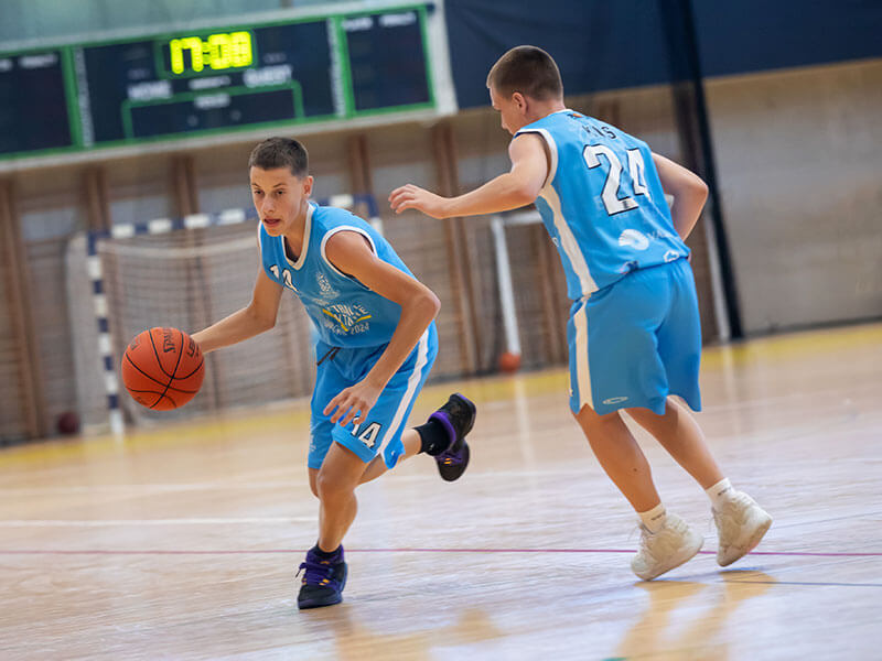Young players dribbling during basketball camp in the sports hall at Valamar Diamant Hotel