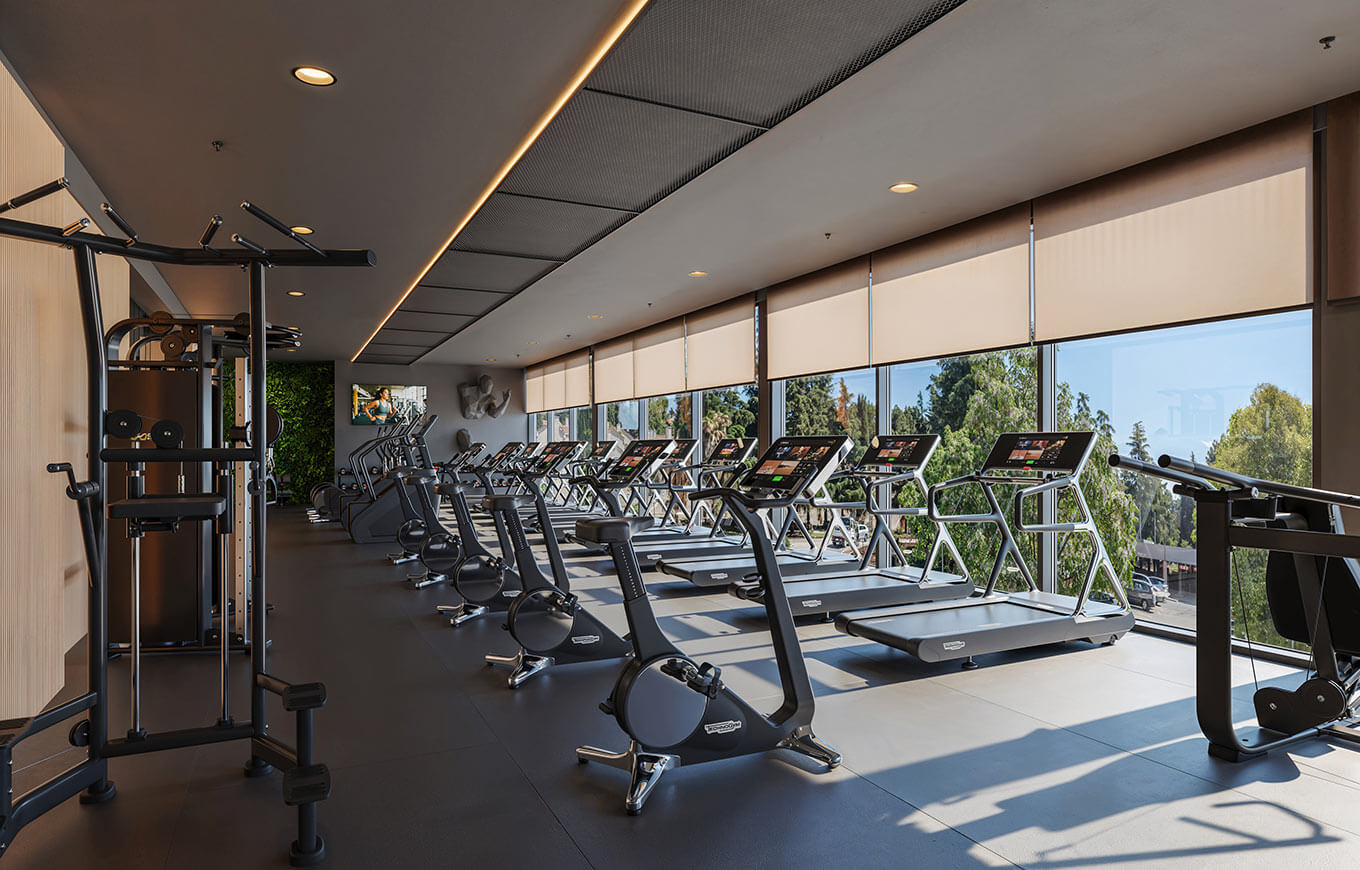 Modern Cardian Fitness centre with exercise equipment and large windows at Valamar Diamant Hotel.