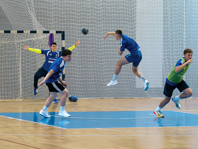 Young players in action at the handball camp in the sports hall at Valamar Diamant Hotel