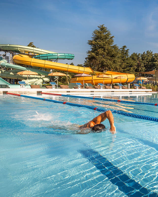 Guest swimming in the outdoor pool at Valamar Diamant Hotel in Poreč