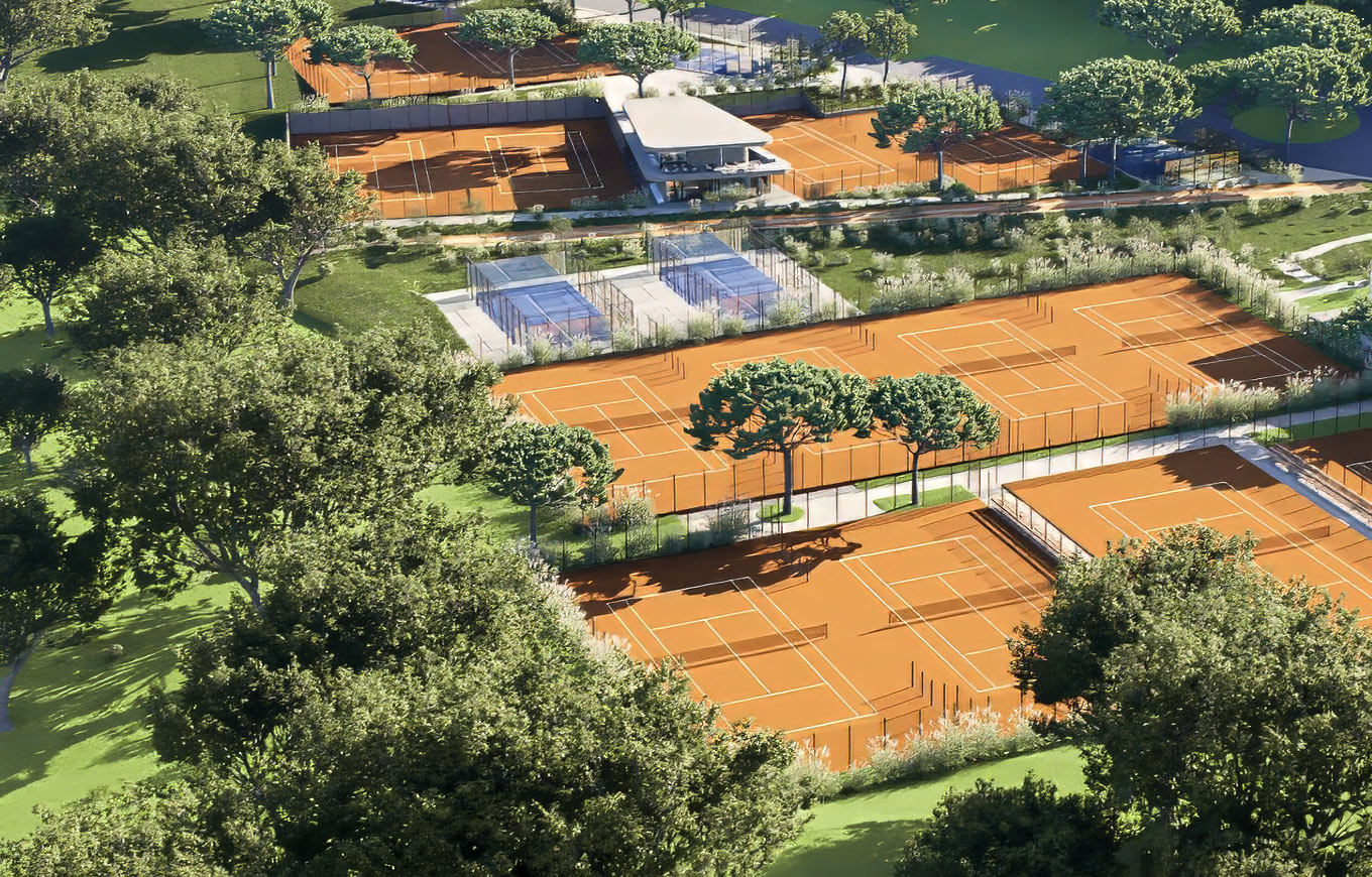 Aerial view of outdoor tennis courts surrounded by greenery at Valamar Diamant Hotel.