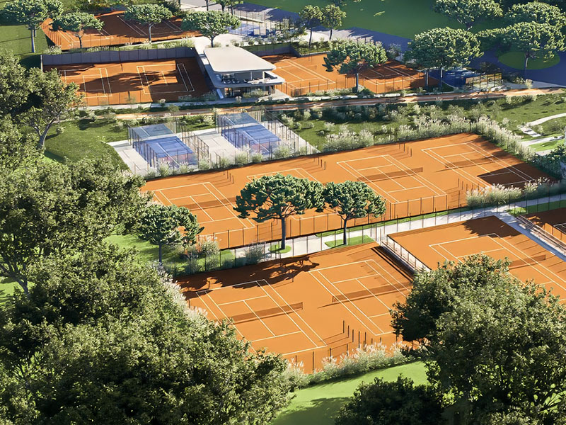 Aerial view of outdoor tennis courts surrounded by greenery at Valamar Diamant Hotel.