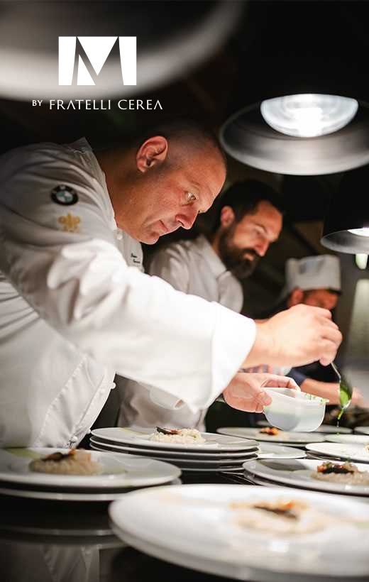 Michelin-star chefs cooking in the Restaurant Miramare by Fratelli Cerea