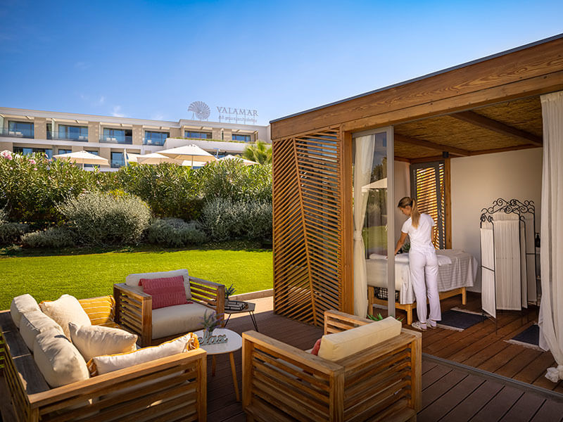 Luxurious spa zone at Isabella Island Resort featuring pool, foot bath, stone loungers, and a healthy Organic Bar, free for guests.