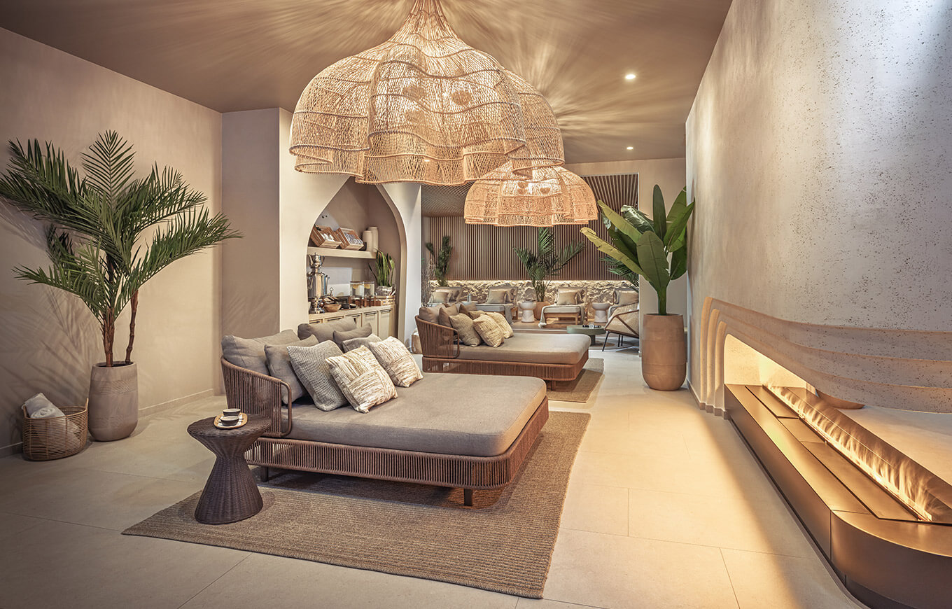 Indoor relaxation area by the fireplace at Balance Spa by Valamar