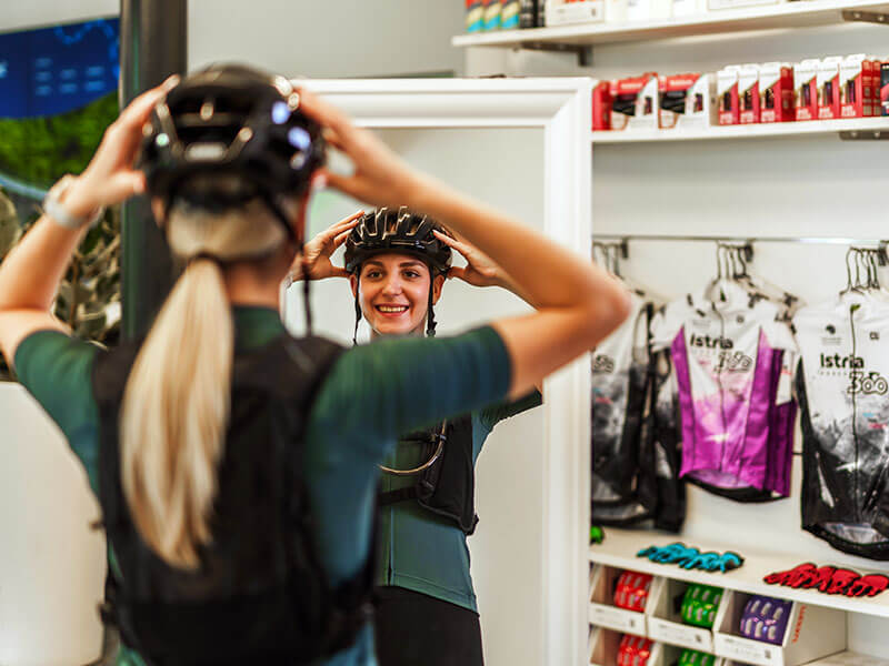 Customer trying on cycling gear at Bike Center Poreč shop