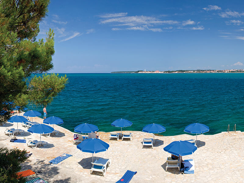 Secluded Crnika Beach on the Adriatic coast with sun loungers