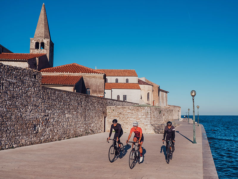Cycling along Poreč waterfront near the Euphrasian Basilica