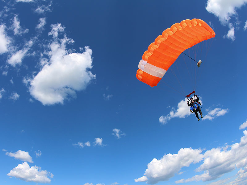 Paraglider soaring through the sky at Fly Club Poreč