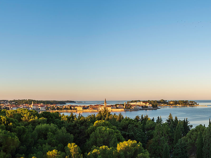 Poreč skyline with historic center, Adriatic coast and Mediterranean forest