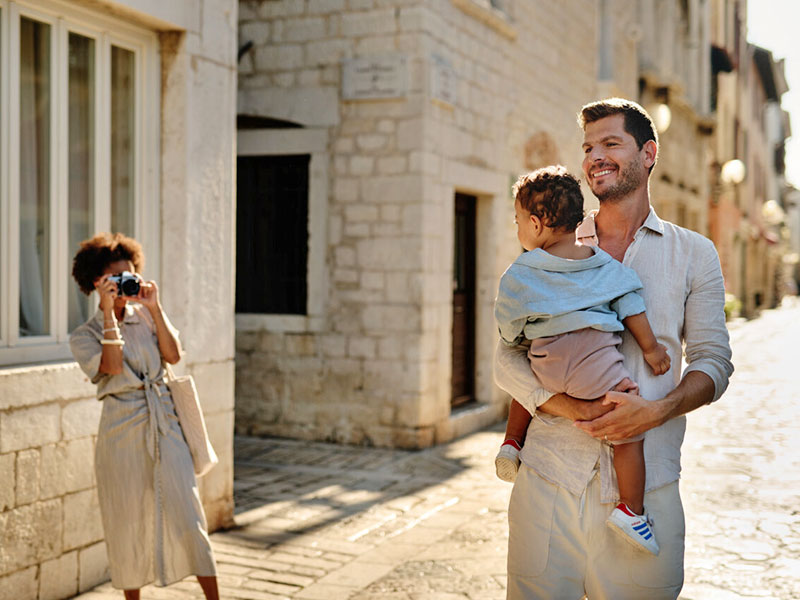 Family walking through old town Poreč