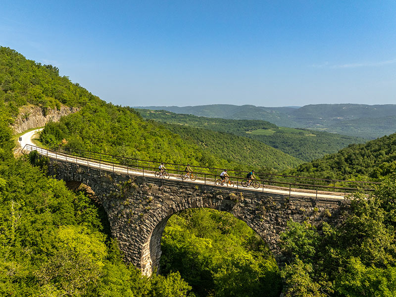 Historic stone bridge along the Parenzana cycling trail in Istria