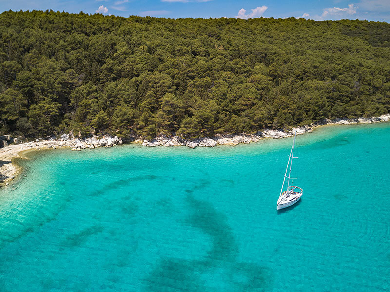 Dundo Forest coastline with turquoise water
