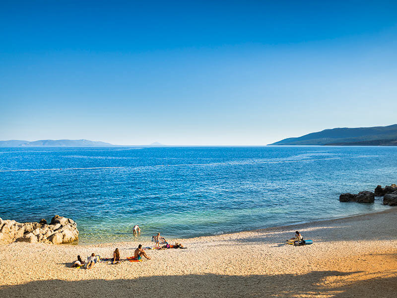 Seaside area with smooth pebbles and peaceful Adriatic setting