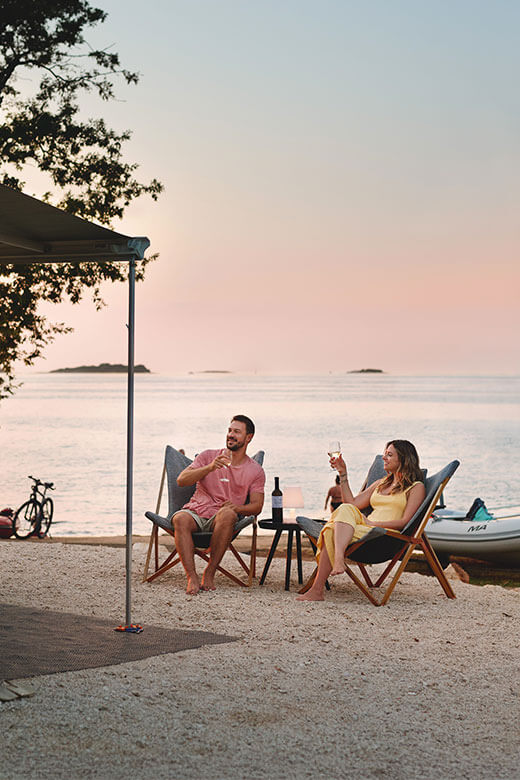 Family camping by the sea with a tent 