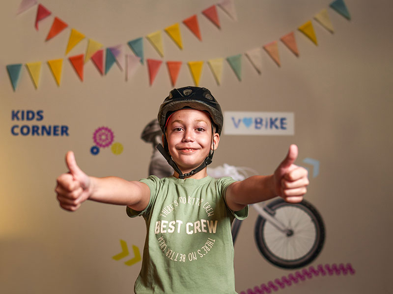 Child with a helmet posing at Valamar Kids Corner, promoting family-friendly cycling activities in Croatia