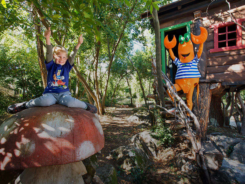 Maro the Crab and a little boy having fun in the Istrian Fantasy Forest at Isabella Island Resort