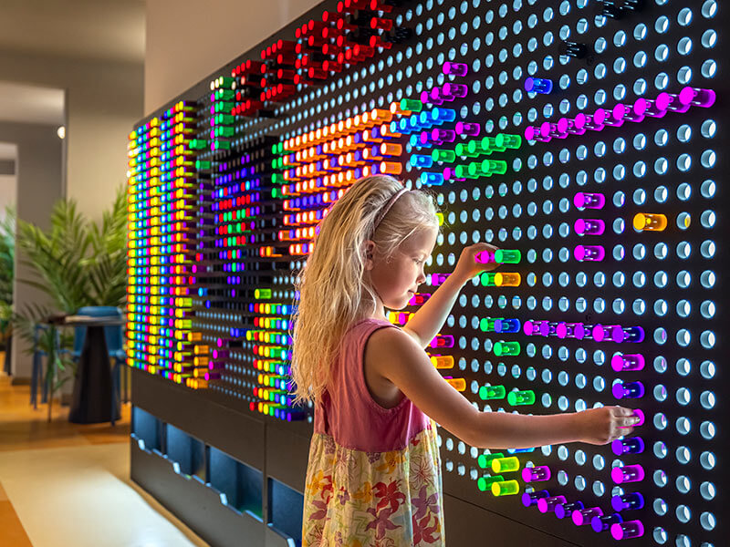 Little girl playing in the Smart Play zone at Maro World