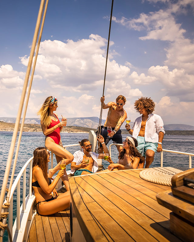 A group of young people on a yacht off the coast of Hvar Island