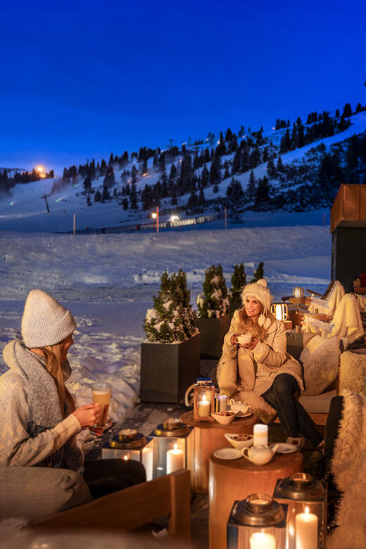 Women drinking on the terrace of the Kesselspitze Hotel in Austria